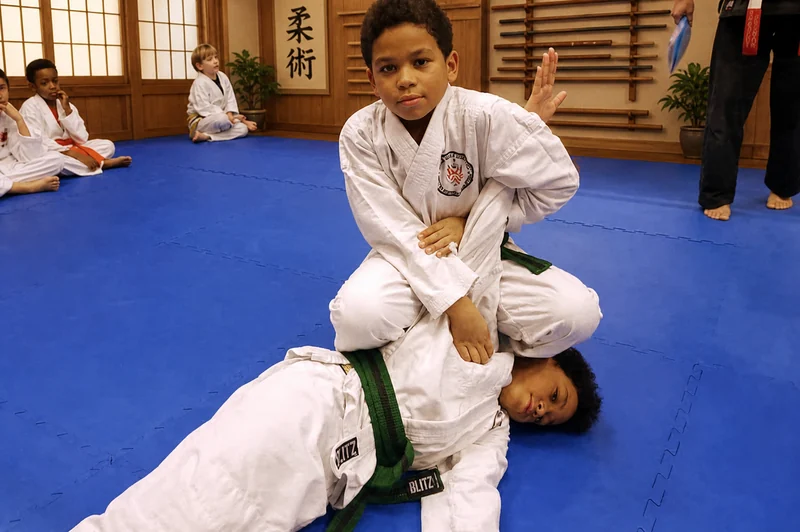 Young Ju-Jitsu students practising a lock